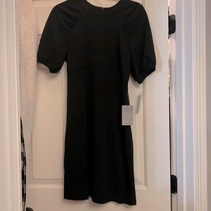 Fully lined Donna Morgan little black dress with cute sleeve detail! Size 8